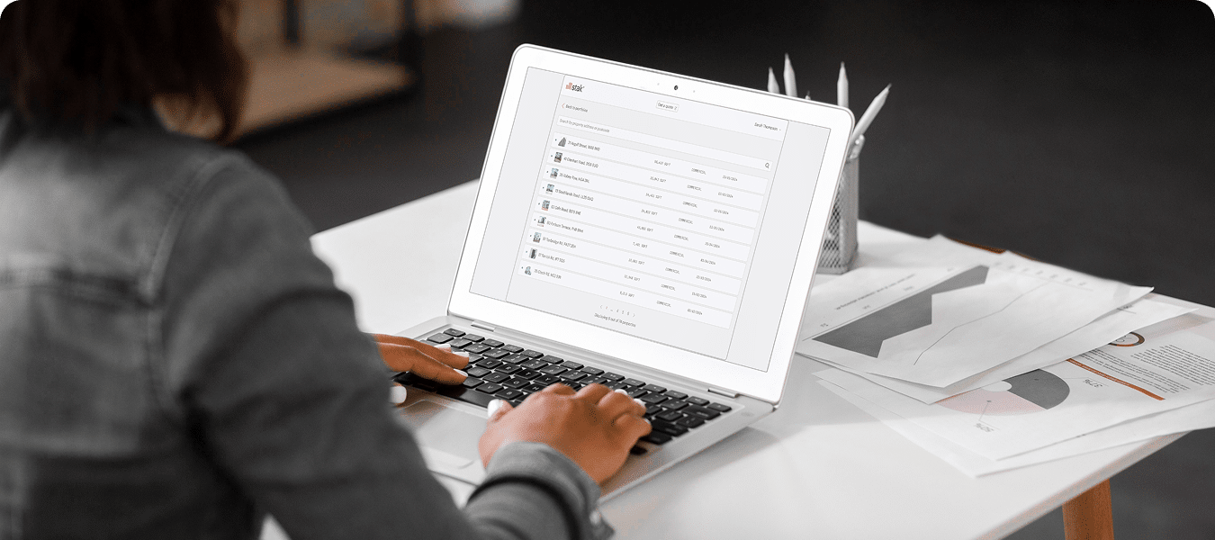Person viewing Stak Hub on a laptop. Stak Hub is your verified, central source of truth, control panel for assets, projects, insights and delivery.