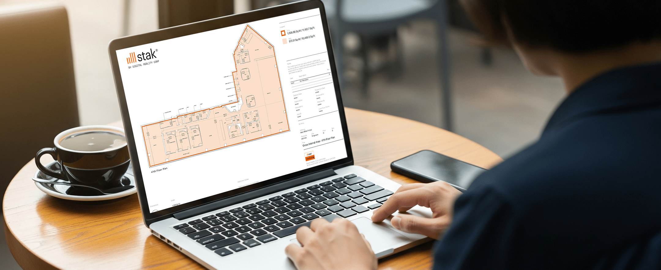 Laptop user accessing Stak, RICS compliant floorplan